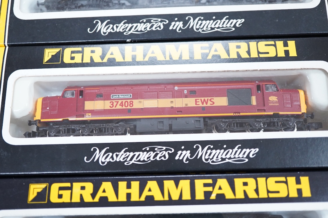 Three boxed Graham Farish N gauge railway electric and diesel locomotives; a Virgin class 90, the Law Society 90013 (882A), a Mainline class 37, 37055 (803D) and an EWS class 37, 37408 (803E).